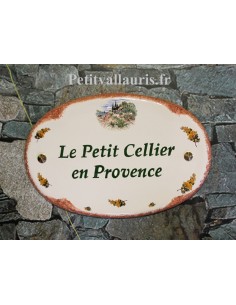 Plaque en céramique émaillée pour maison de forme ovale décor Cabanon et brins de mimosas bord ocre inscription personnalisée