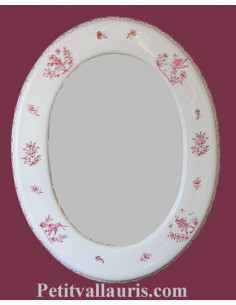 Miroir en faïence blanche de forme ovale décor reproduction moustiers rose